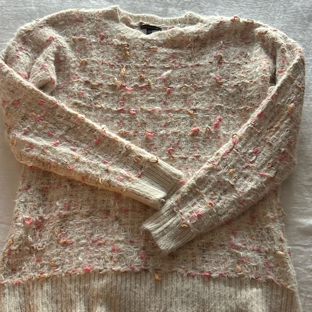 Beautifully detailed tunic length crewneck sweater